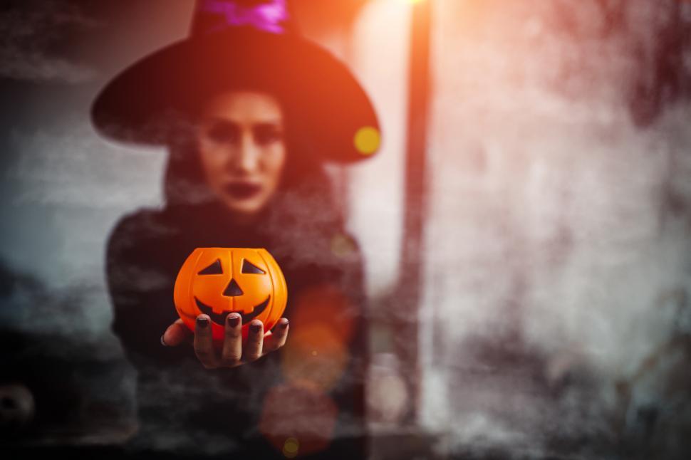 Free Image of Halloween witch with pumpkin  