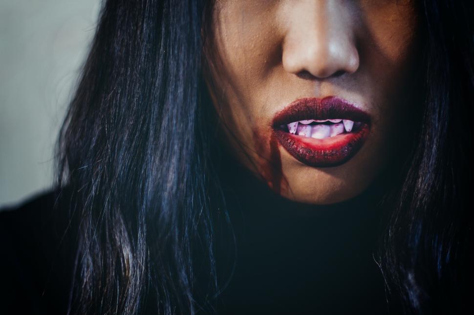 Free Image of Close up Red lips with fangs - Halloween concept 