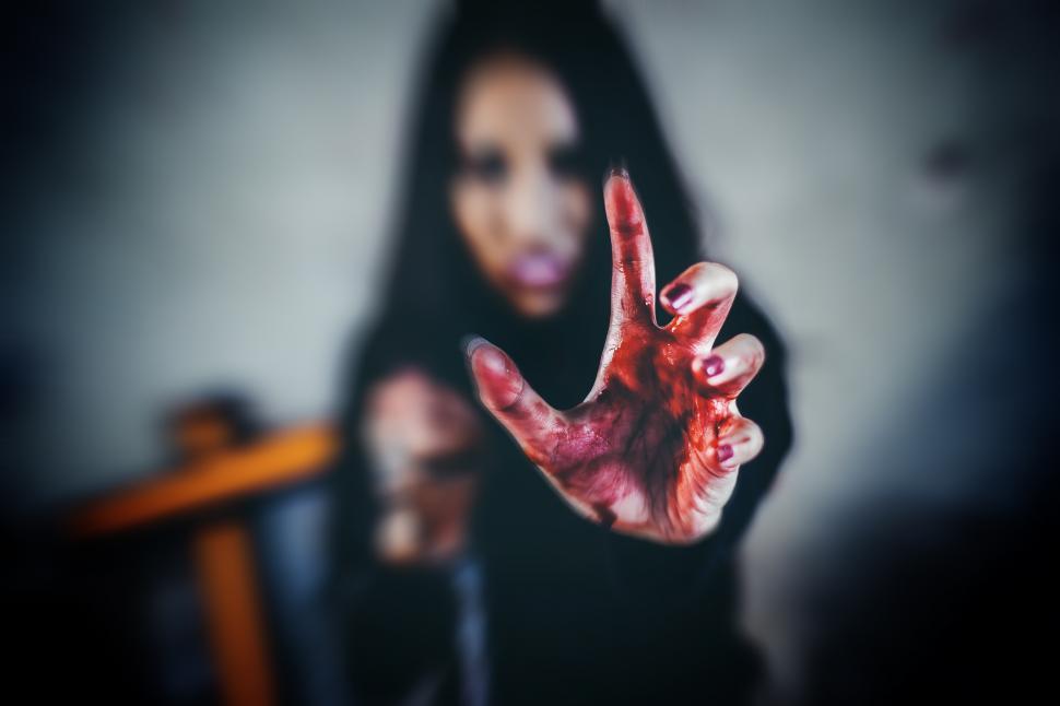Free Image of Bloody hands of a young witch 