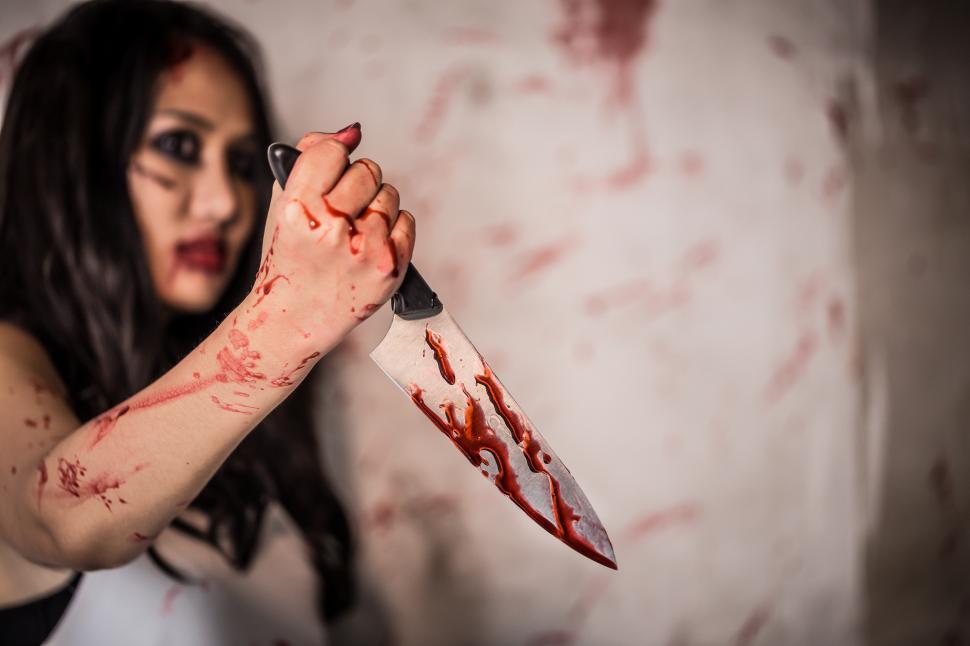 Free Image of Horror photo of a diabolic killer with bloody knife 