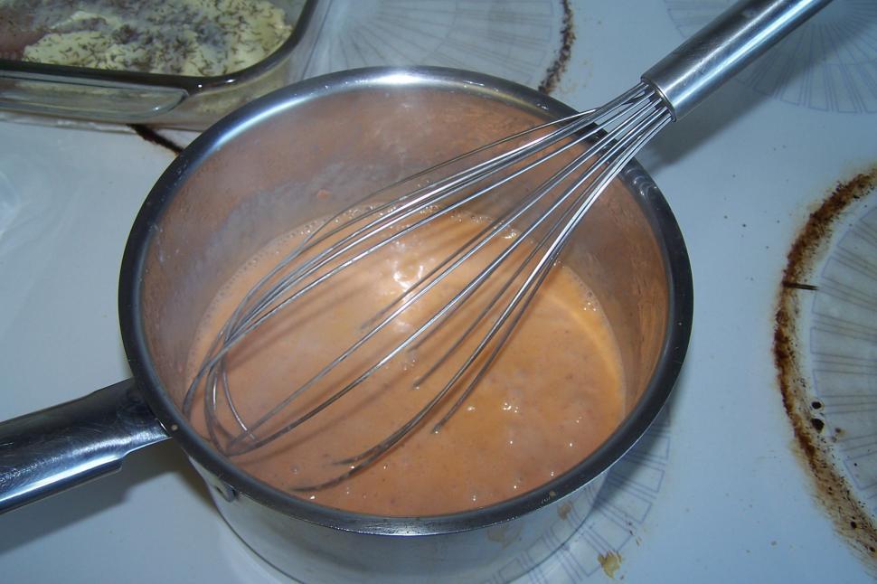 Free Image of Whisk Stirring Saucepan on Stove 