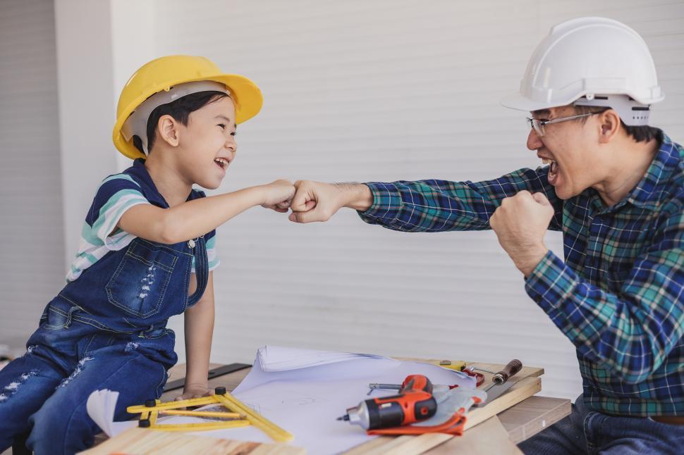 Free Image of Father and boy enjoy playing with tools 
