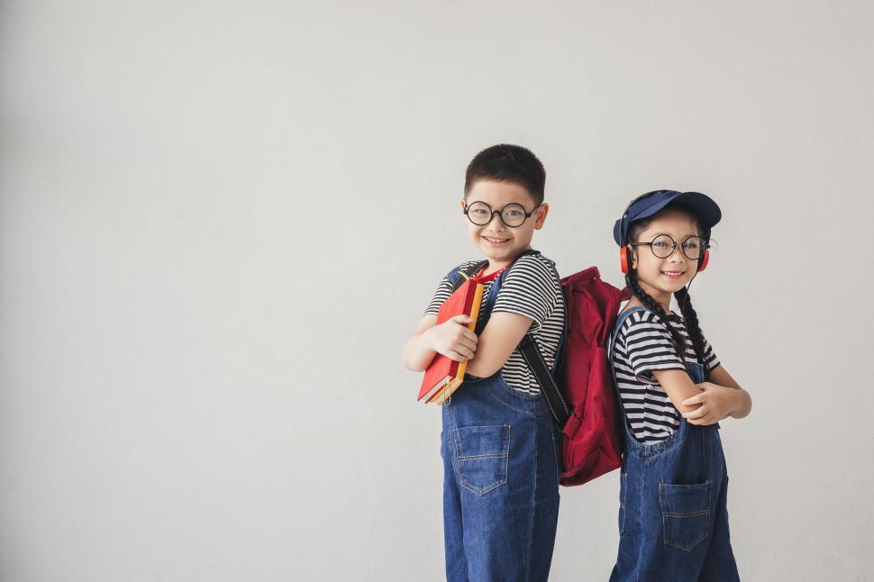 Free Image of Education concepts - Little boy and little girl ready for school 