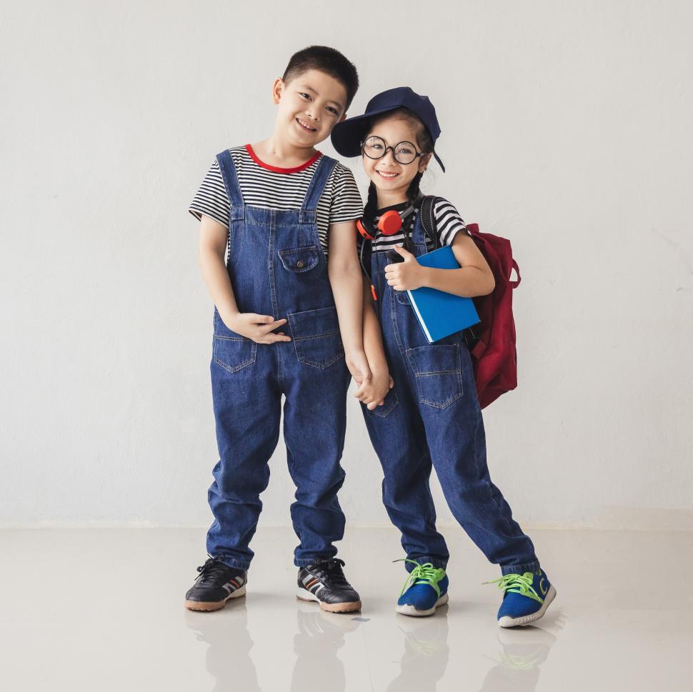 Free Image of Big brother and little sister head to school 