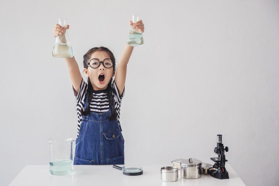 Free Image of LIttle girls is excited about science. STEM education. 