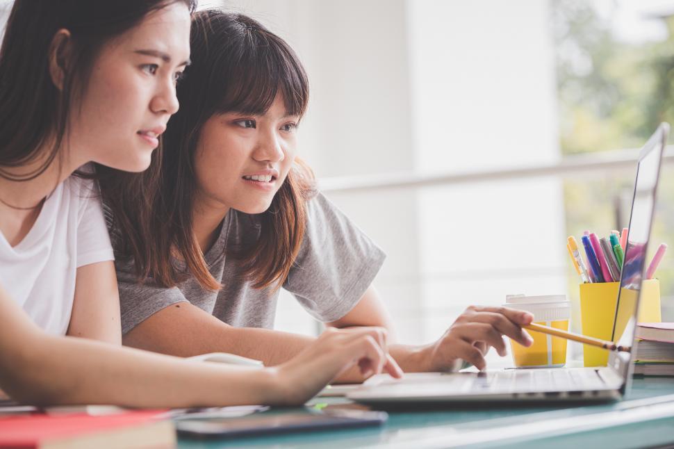 Download Free Stock Photo of Two Students Learn from Computer 