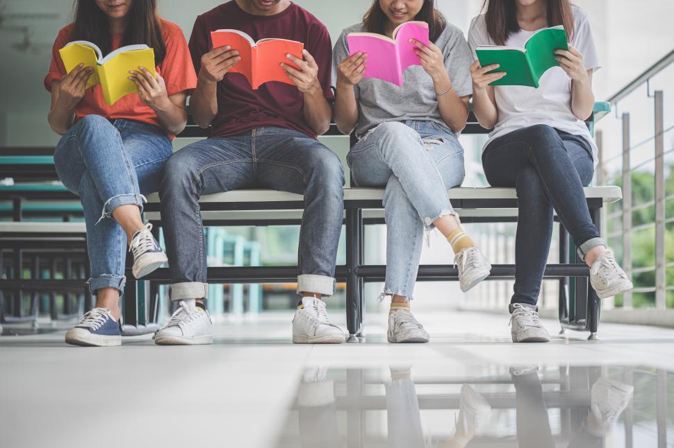 Download Free Stock Photo of Group of anonymous students sit reading 