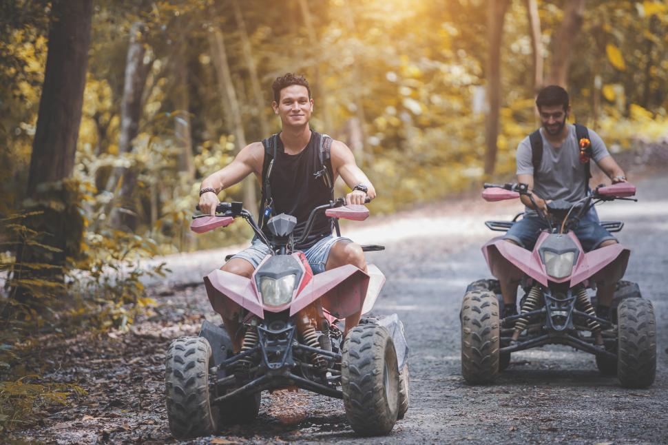 Download Free Stock Photo of ATV riders on dirt road 