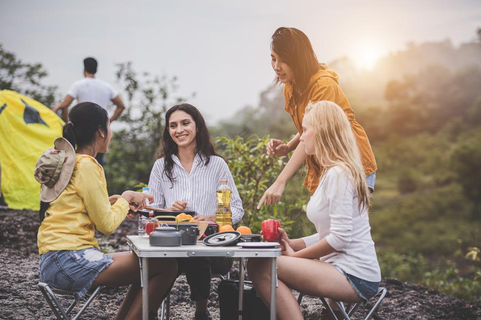 Download Free Stock Photo of Group of friends eating at the camp site 