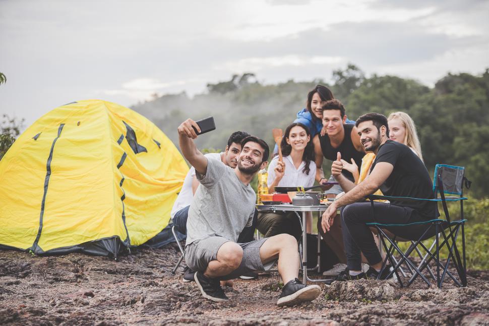 Download Free Stock Photo of Camping season, Group of campers are having fun taking selfies 