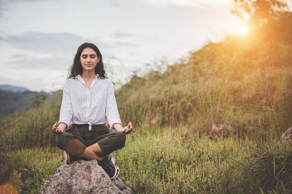 Free Image of Young woman meditating outdoors 