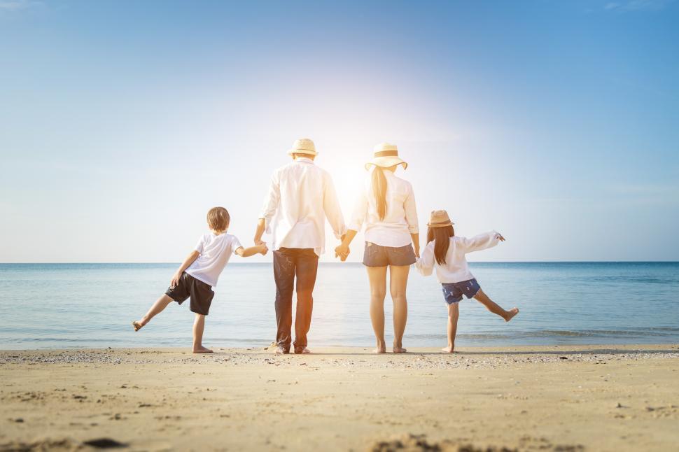 Free Image of Family vacation holiday, Back of the family walking hand in hand 