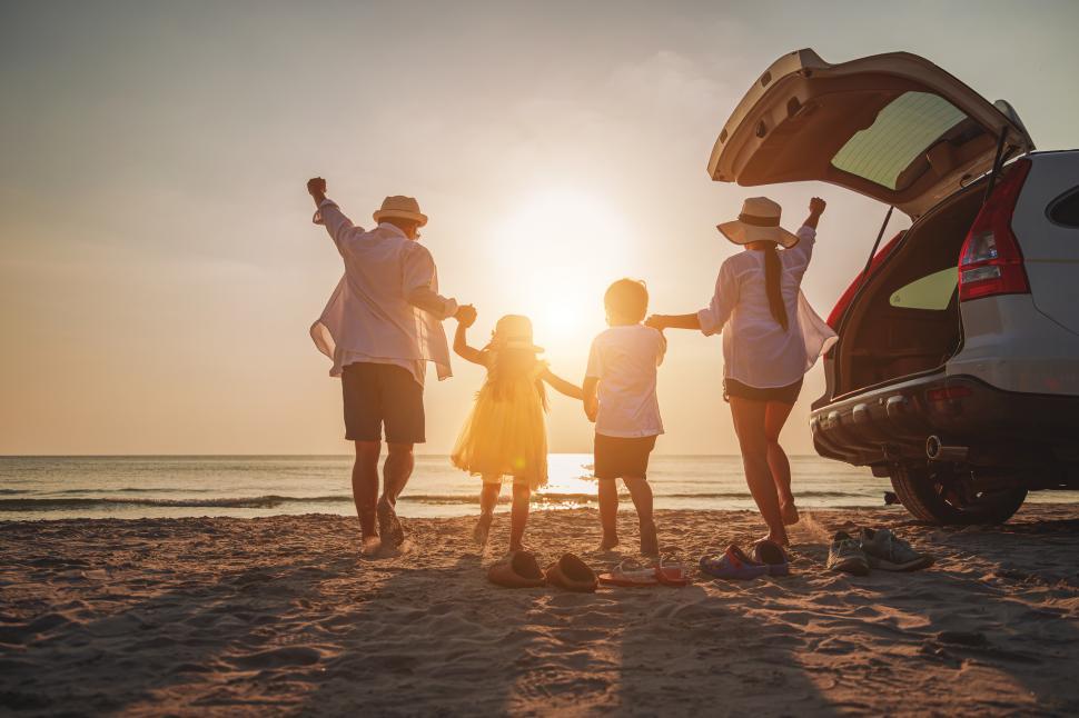Free Image of Sunset at the beach with family of four 