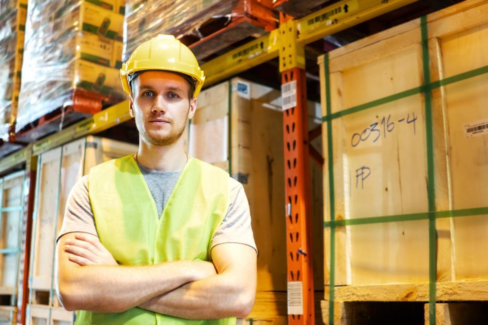 Free Image of Warehouse worker standing in distribution center 
