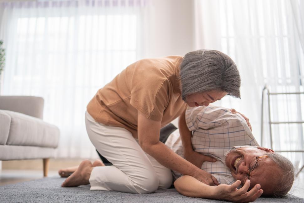 Free Image of Senior wife helping husband fainting and falling 