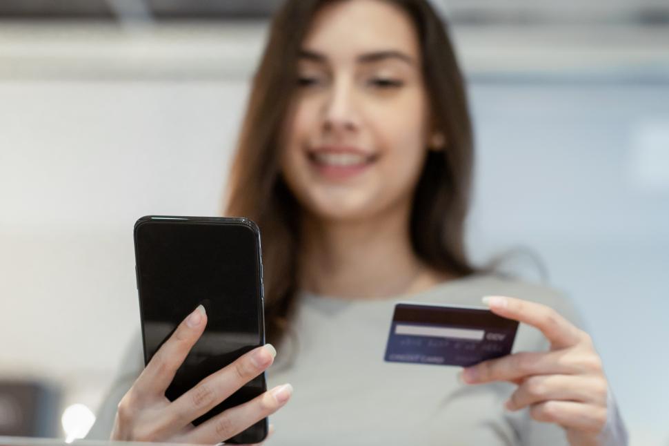 Free Image of Woman shopping and purchasing online with credit card 