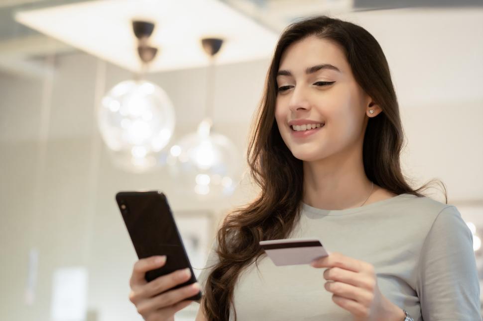 Free Image of Woman shopping and purchasing with credit card 