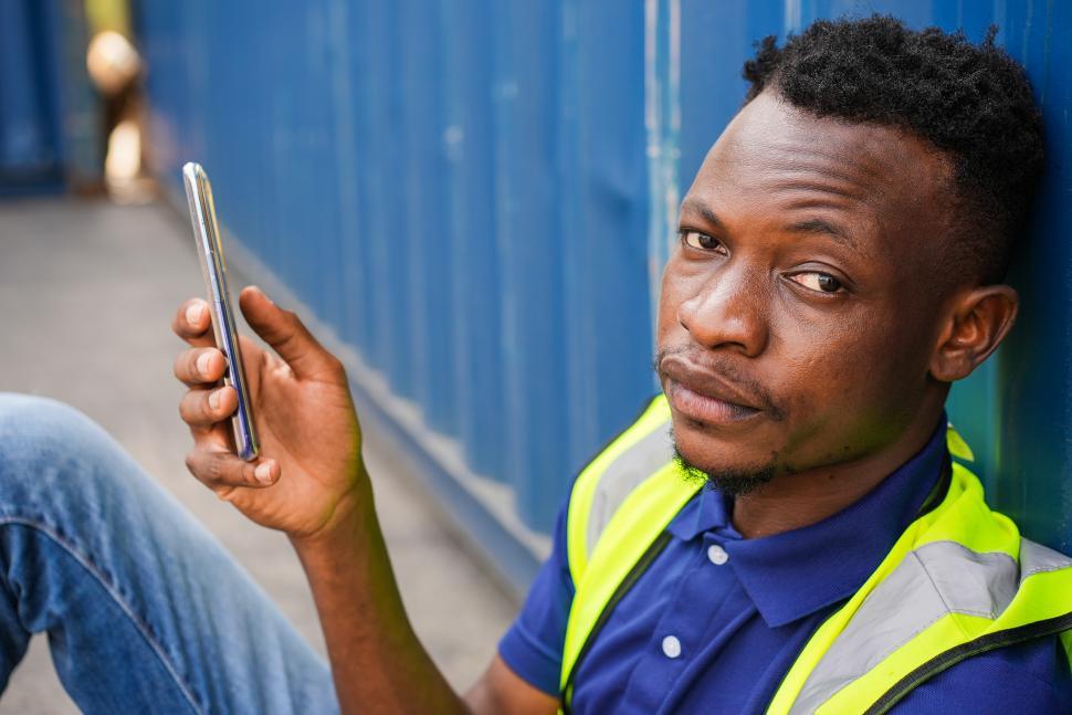 Free Image of African American worker chatting on mobile phone 