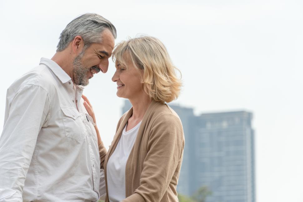 Free Image of Romantic Caucasian senior man and woman standing together outdoors 