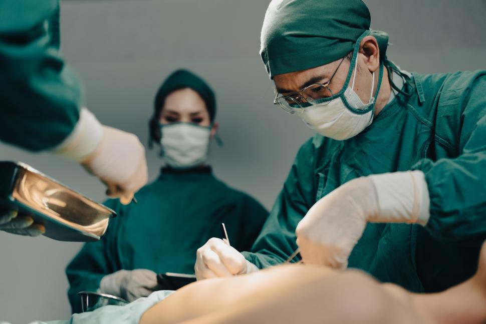 Free Image of Team performs surgical operation 