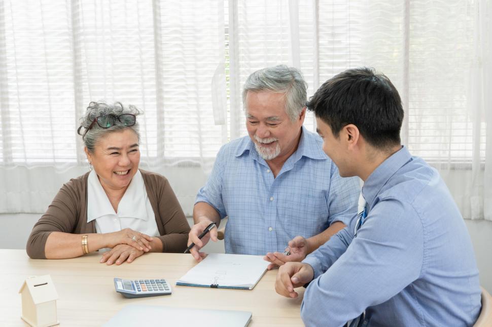 Free Image of Senior couple signing contract with real estate agent 