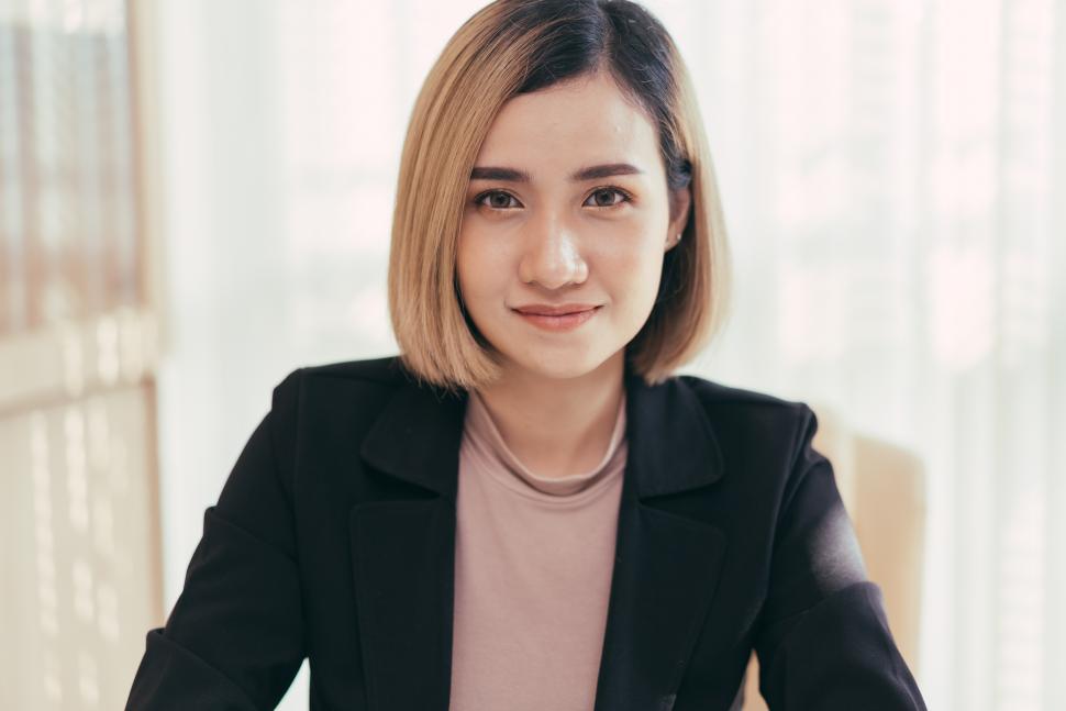 Free Image of Portrait of young female manager looking at camera 