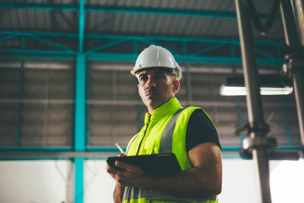 Free Image of Portrait of engineer foreman holding on digital tablet 