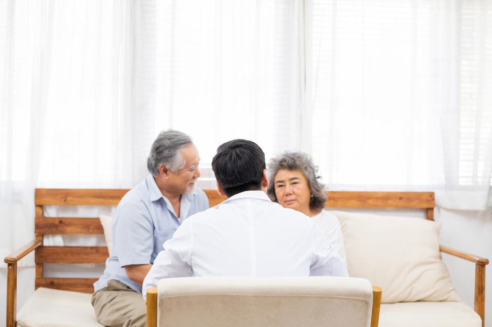 Free Image of Doctor consulting with senior couple 