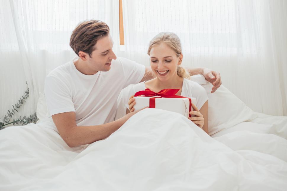 Free Image of Man giving gift box to his girlfriend 