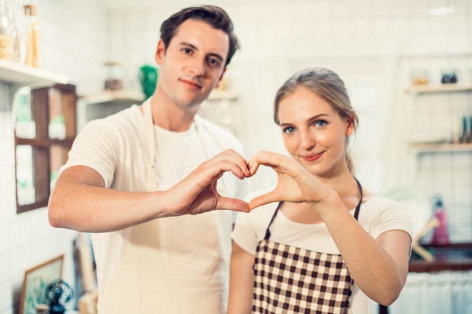Free Image of Couple making heart shape together. showing of love 