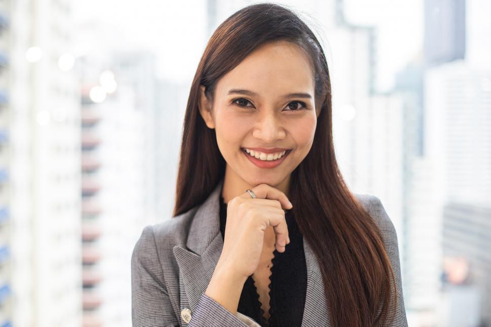 Download Free Stock Photo of Portrait of smiling businesswoman standing in the office 