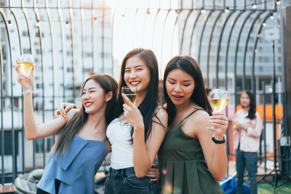 Free Image of Group of happy girlfriends celebrating party with champagne 