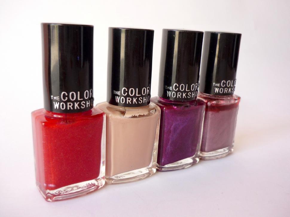 Free Image of Three Bottles of Nail Polish Arranged in a Row 