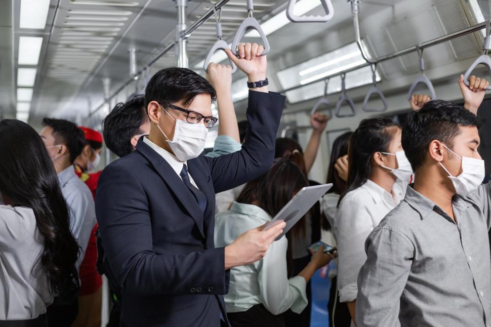 Free Image of Man wearing medical mask on the subway 