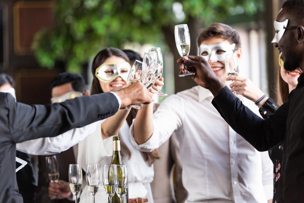 Free Image of Group of office worker in fancy masks having celebration party 