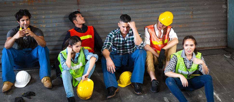 Download Free Stock Photo of Depressed group of industrial worker tired of work or losing jobs 