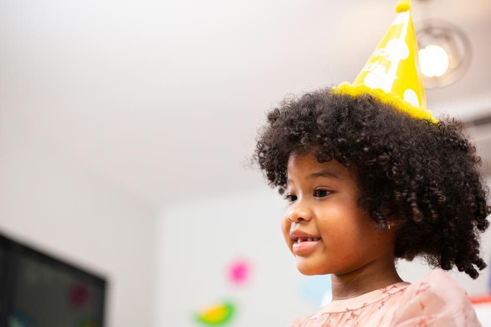 Free Image of Portrait of African American girl in party hat 