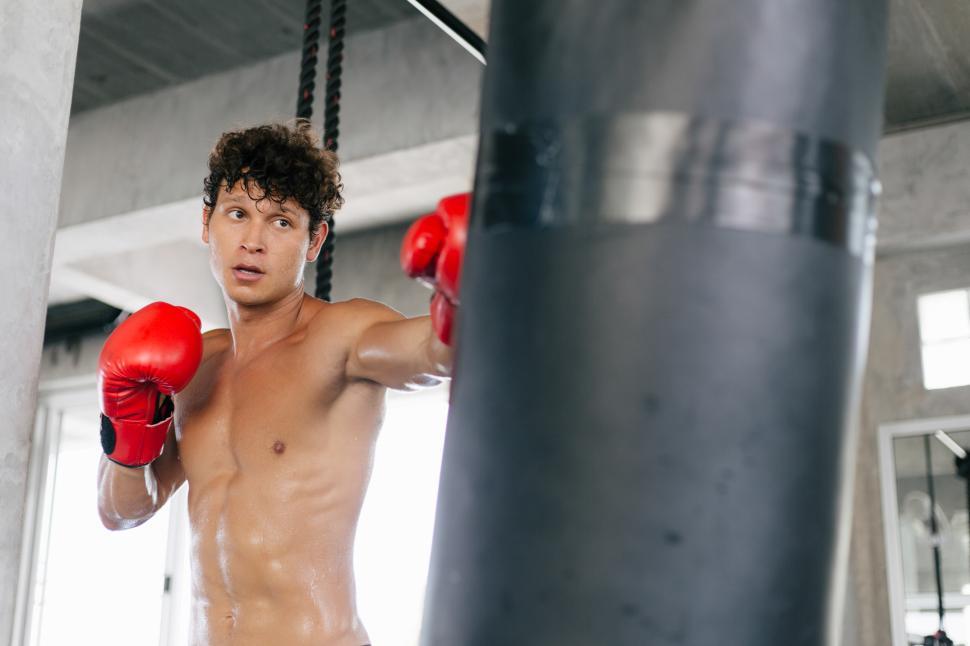 Download Free Stock Photo of Muscular man boxing at the fitness 