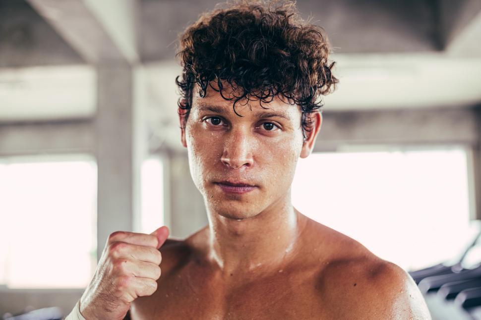 Download Free Stock Photo of Portrait of boxer standing ready to fight. 