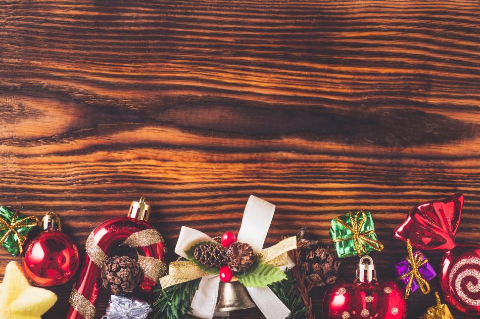 Download Free Stock Photo of Christmas decorations on wood background 