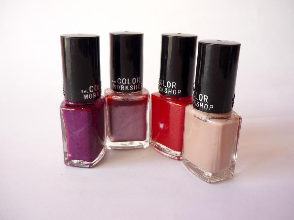 Free Image of Three Bottles of Nail Polish Arranged Neatly 