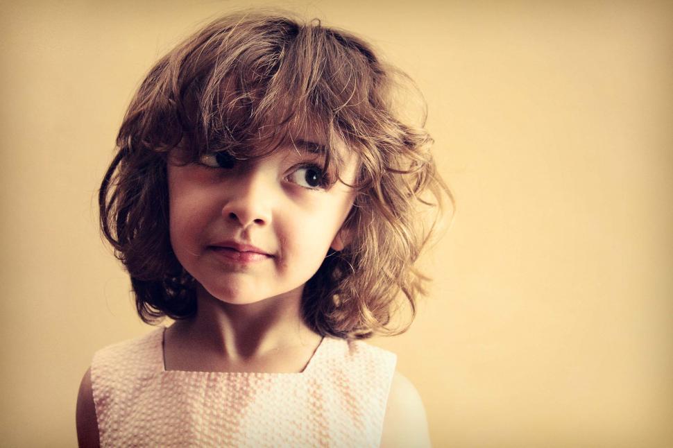 Free Image of Little girl with mischievous look 