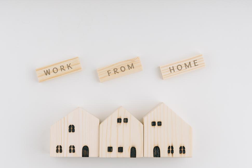 Download Free Stock Photo of WORK FROM HOME wording on wooden blocks and wooden houses 