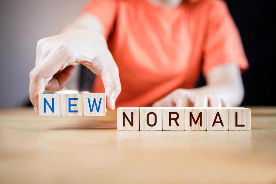 Download Free Stock Photo of Woman putting wooden cubes with concept new normal 