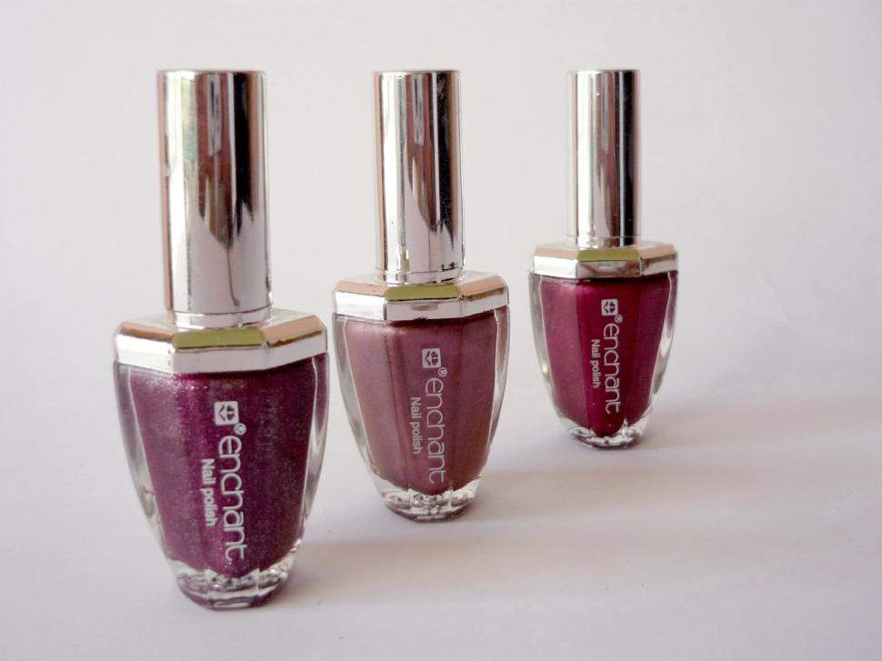Free Image of Three Bottles of Nail Polish Arranged Side by Side 
