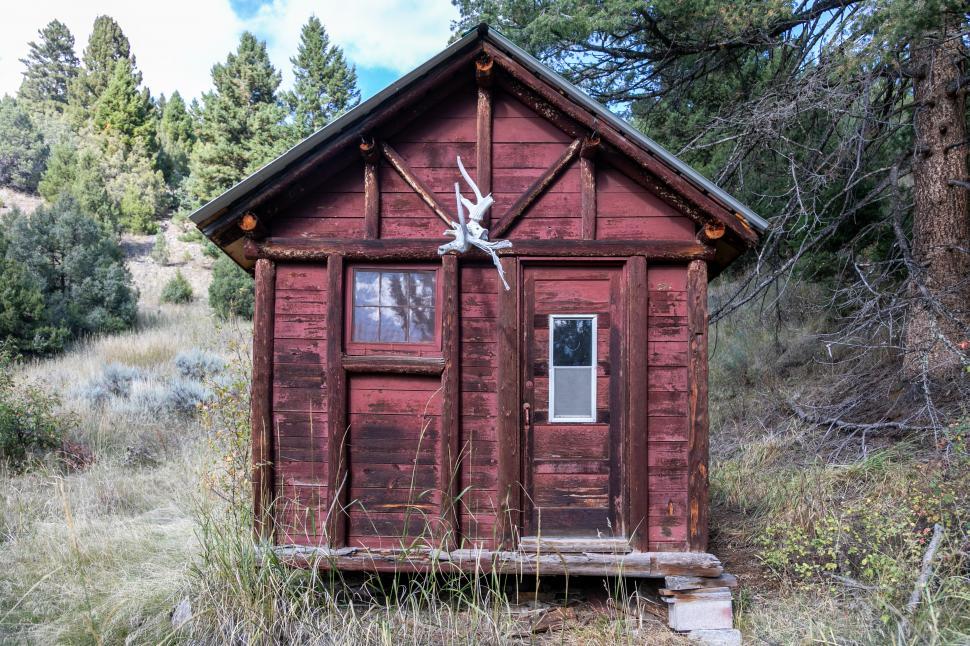 Free Image of Front view of small rustic cabin 