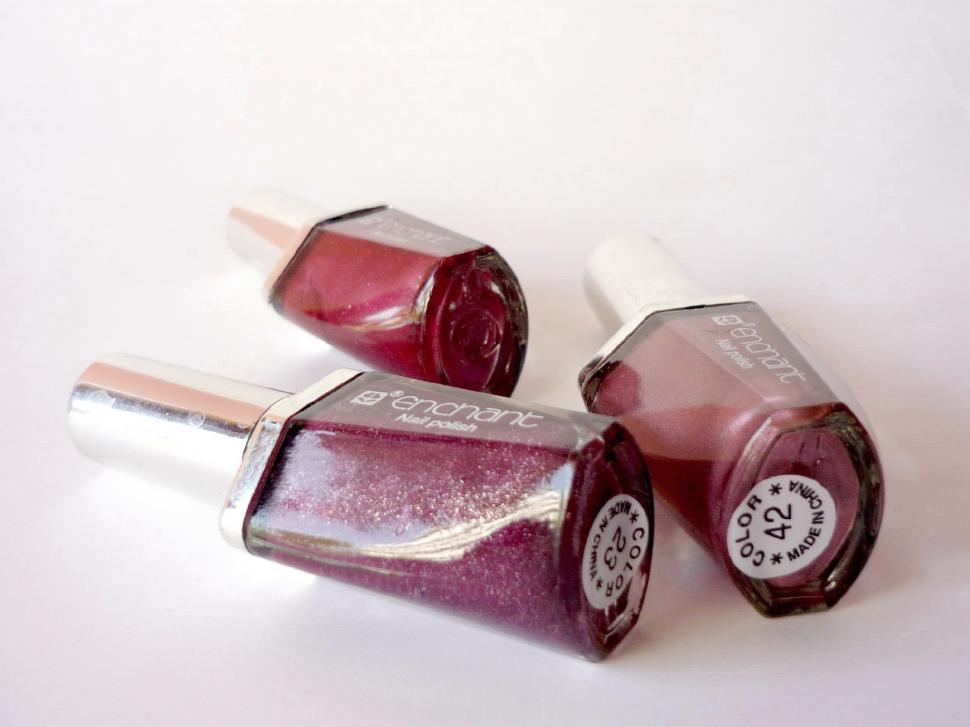 Free Image of Two Bottles of Nail Polish on a White Surface 