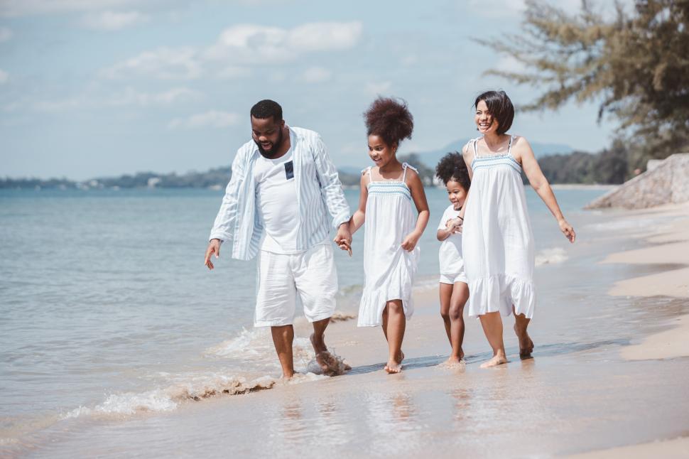 Free Image of Happy family of four on the beach 