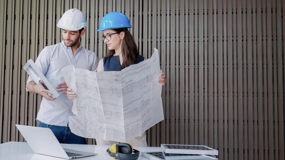 Free Image of Architects reviewing plans 