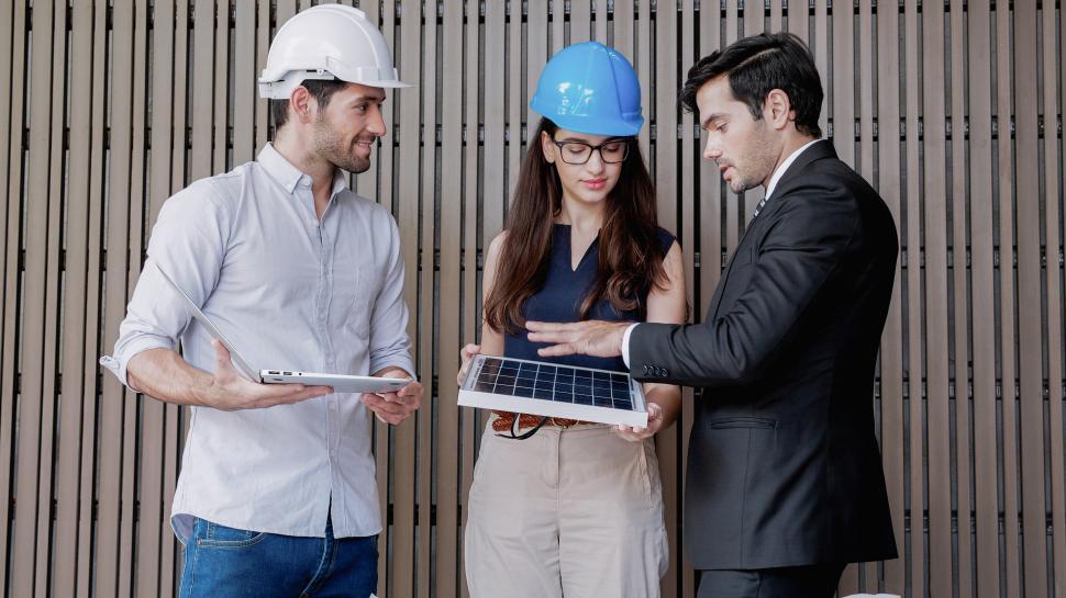 Free Image of Solar technology engineers in business discussion 